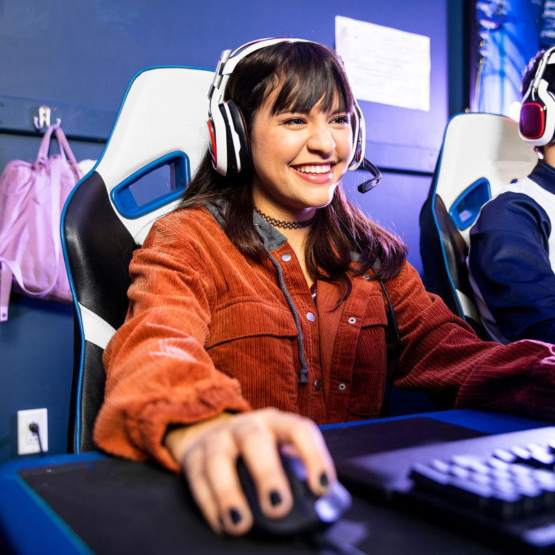 Teenager playing games on a computer.